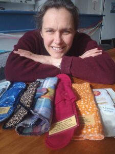 Michelle with washable pads on a table
