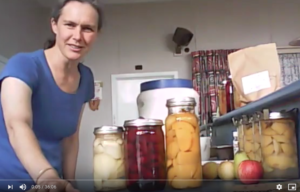 Michelle in the kitchen with bottled fruit