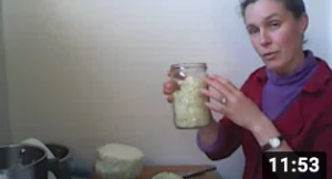 Michelle holding a jar of sauerkraut